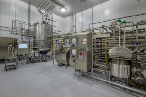 Steel tanks and pipes for milk processing and pasteurization.
