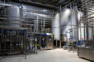 Bottles filled with ice tea on the factory production line